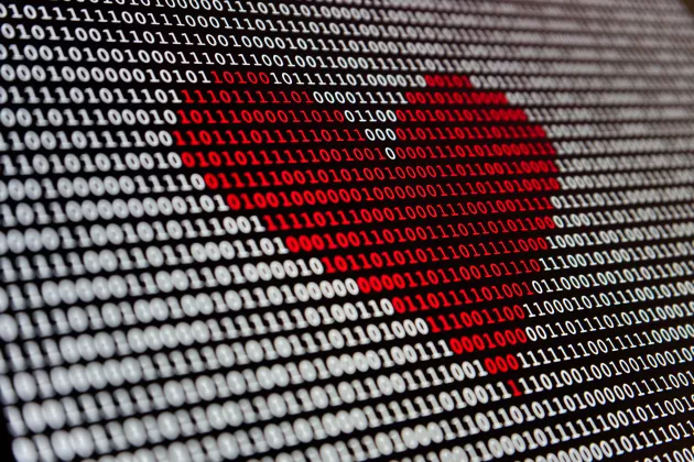 A red heart formed by numbers on a screen. 